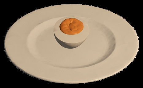 A halved ramen egg with a golden yolk